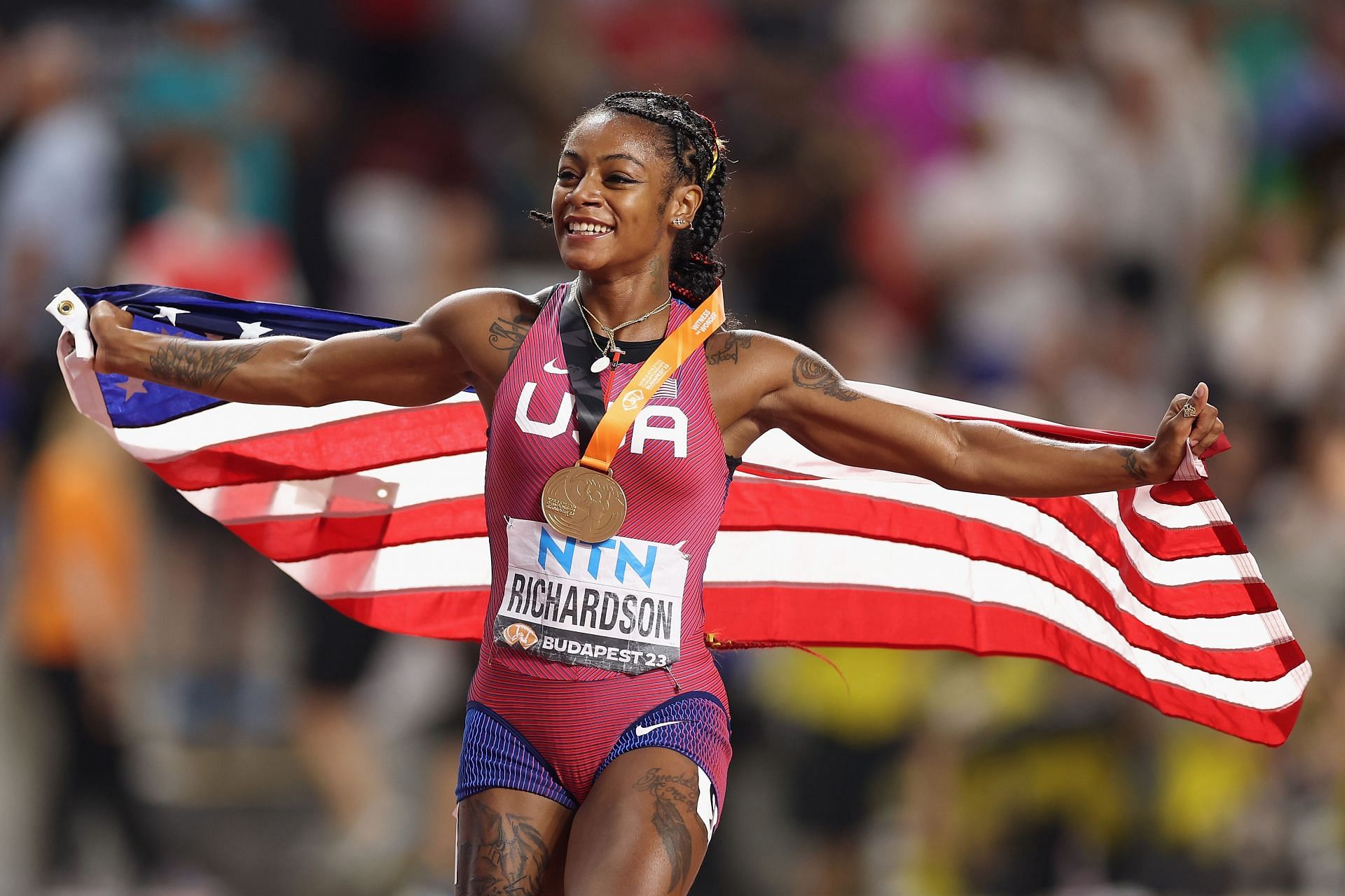 Sha'Carri Richardson of Team United States celebrates winning the Women's 100m Final during the World Athletics Championships 2023 in Budapest, Hungary.